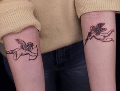 two people with matching tattoos on their arms