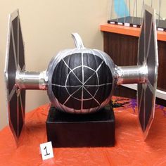 a star wars themed pumpkin sitting on top of a table