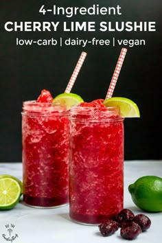 two glasses filled with cranberry lime slushie on top of a table