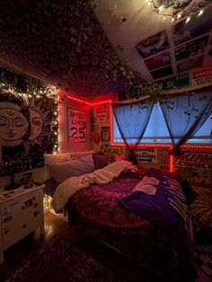 a bedroom decorated with lights and pictures on the wall