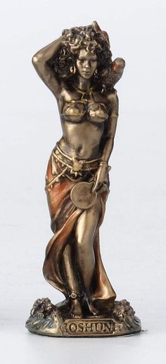 a bronze statue of a woman holding her head with one hand and the other arm behind her head