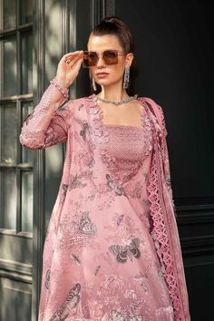 Brand: Maria.BCollection: Maria.B Unstitched M.Prints Fall EditionFabric: Cambric PRODUCT DETAILS: ShirtPrinted ShirtEmbroidered NecklineEmbroidered 3D Flowers For Neckline Patti & PatchesEmbroidered Sleeves PatchesFabric: CambricColor: Pink DupattaPrinted DupattaFabric: ChiffonColor: Pink TrousersPrinted TrousersFabric: CambricColor: PinkNote: Dry Clean Only DISCLAIMER:* Lining, Laces, and Tassels are not included in unstitched variants.* Embellishment items in stitched outfits are subject to market availability.* Product color may vary due to photographic lighting or your device settings. CARE INSTRUCTIONS: Extra Fabric Has Been Used For Shoot Original Color May Vary Slightly From The Picture Dry Clean Recommended Iron The Clothes At Moderate Temperature Do Not Use Bleach, Or Stain Remov Pakistani Summer Dresses, Suits Usa, Modest Girl, Pakistani Designer Clothes, Maria B, Pakistani Designers, 3 Piece Suits, 3d Flowers, Casual Wedding