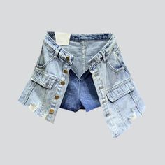 Introducing the 2023 Summer Collection's distressed hem buttoned denim skort. a grunge-inspired masterpiece perfect for the modern fashionista!Why You'll Fall In LoveThis skort is a unique combination of vintage-inspired grunge and urban flair. tailored to fit comfortably and stylishly. Its mid-waist rise. distressed hem. and buttoned closure all come together to create a timeless look that will take you from day to night with ease.Unmissable Highlights: Grunge-Inspired: Tap into the grungy vibe Trendy Cutoff Denim Skirt With Built-in Shorts, Mid-rise Button Jean Shorts For Spring, Medium Wash Jean Shorts With Button Closure For Spring, Trendy Washed Denim Blue Jean Shorts, Trendy Cutoff Jean Shorts With Pockets, Trendy Medium Wash Denim Skirt With Built-in Shorts, Spring Dark Wash Jean Shorts With Button Closure, Dark Wash Jean Shorts For Spring, Medium Wash Button-up Denim Shorts