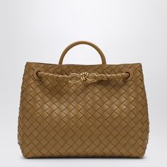 Medium leather cross-body bag from Bottega Veneta featuring a Dark Praline-coloured Intrecciato pattern, a slide handle and shoulder strap, a metal Knot detail on the front, an internal flat pocket, an internal zipped pocket and gold-tone metal hardware. Elegant Shoulder Bag With Braided Round Handles, Designer Bags With Braided Handles And Top Handle, Designer Bags With Top Handle And Braided Handles, Luxury Bags With Braided Handles, Elegant Satchel With Braided Handles, Elegant Crossbody Bag With Braided Handles, Luxury Shoulder Bag With Braided Handles For Formal Events, Modern Satchel With Braided Handles, Luxury Satchel With Braided Double Handles