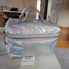 Longchamp Silver Iridescent Mini Cross Body Brand New! Hand To Find. My Daughter Received One As A Gift. I Bought Her One, And Can't Return Mine. All Serious Offers Will Be Considered Silver Glossy Finish Bags, Longchamp Crossbody, Longchamp Bags, Mini Cross, My Daughter, Silver Color, Cross Body, Crossbody Bags, Bag Lady