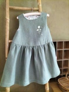 This pure lightweight linen pinafore dress is embellished with hand-embroidered floral embroidery, the upper yoke is lined with handmade floral fabric. Details: - Color: sage green - Composition: 100% Oeko-Tex certified linen - Buttons in the back - Lightweight linen - Care: wash at 30o, medium spin, air dry or tumble dry at low temperature, medium ironing Linen Pinafore Dress, Linen Pinafore, Color Sage Green, Pinafore Dress, Fabric Details, Floral Fabric, Floral Embroidery, Air Dry, Sage Green