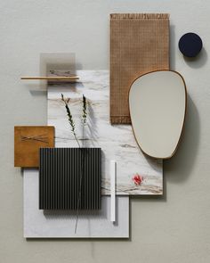 an assortment of modern objects on display in a room with white walls and flooring