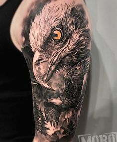 a man with an eagle tattoo on his arm