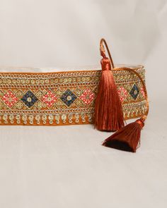 Embroidered obi belt with tassels, handmade in Paris using embroidered indian laces sourced in the mythic city of Jaipur. They are the perfect accessory to transform any boring dress in a boho statement piece.  We love it's exotic & vintage look and we are sure you will love it too!  HOW TO CLOSE THE BELT:  The belt features satin straps with tassels at the end that you can tie around your waist to show the tassels on the front or at the back.  MATERIALS: The belts are lined with a linen or cott Traditional Embroidered Bridal Belt For Festive, Festive Party Embroidered Bridal Belt, Traditional Brown Belt For Festivals, Traditional Adjustable Embroidered Belts, Tassels Handmade, Boho Belt, Boho Belts, Polycotton Fabric, Obi Belt