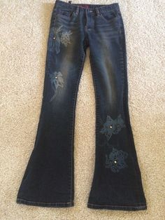 Excellent condition, boho hippie jeans with floral design and embellishments. Size 28 Flat Measurements Waist 13 1/2"Inseam 29 1/2Waist to bottom 39 90s Bottoms, Bohemian Embellished Bottoms For Festival, Bohemian Fitted Embellished Bottoms, Embellished Fitted Bohemian Bottoms, Bohemian Embellished Fitted Bottoms, Fairy Jeans, Fitted Cotton Hippie Jeans, Hippie Denim Blue Bottoms, Fitted Denim Hippie Bottoms