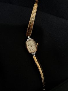 Gold vintage dainty 1960s Elgin watch with diamond bezel.  Condition: Great Length: Will fit anywhere between 6-7 inch circumference wrist UNTESTED so it may or may not work if repaired. Come shop with me and discover timeless treasures, unique finds, classic charm, and always a touch of sparkle. Happy shopping!  All items are carefully cleaned and packaged with love.  Each sale allows me to continue doing what I love, so my goal is to help you find a bit of arm candy that you absolutely adore! Women’s Dainty Gold Watch, Small Dainty Gold Watch, Dainty Gold Watch, Antique Gold Watches With Subdials, Small Gold Vintage Watch, Dainty Gold Watch Vintage, Elgin Watch, Good To Great, Minimalist Women