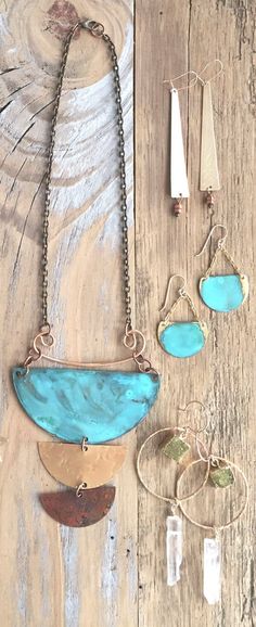 "Brass has been oxidized with. Verdigris patina and hangs from brass chains and gold-filled ear wires. Earrings measure approx. 1\"x2\". Shades of the patina vary due to the organic chemistry of the patina process. Colors can range from turquoise to aqua green. We have no control over this shade variation so please understand when ordering that we cannot grant specific green shade requests. This process produces unique and original colors so each pair of earrings is a one of a kind just like you Artistic Bronze Dangle Jewelry, Copper Dangle Jewelry With Patina, Copper Dangle Earrings With Patina, Artistic Copper Jewelry With Soldered Details, Handmade Hammered Bronze Copper Jewelry, Artistic Metal Jewelry With Patina, Artisan Teardrop Jewelry With Patina, Artisan Copper Jewelry With Oxidized Finish, Gold Dangle Jewelry With Patina