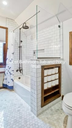 a bathroom with a toilet, sink and bathtub next to a window in it