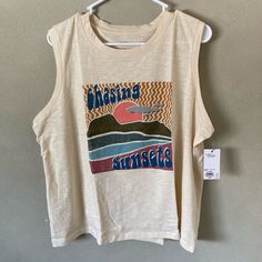 Item Description: Show Your Love For Sunsets At The Beach In This Retro Style Muscle Tee. Features The Sunset With “Chasing Sunsets” In Vintage Writing. Nice And Soft Material, Perfect For The Summer! Brand: Sonoma Size: Xxl Available Measurements: Please Ask Material: 100% Cotton Color: Cream, Blue, Pink, White, Orange, Green Style: Summer, Vintage, Retro, Muscle Tee Brand New With Tags And In Original Packaging! Disclaimers: All Used Clothing Is Washed In Warm Water With Tide Laundry Detergent Beige Sleeveless Top For Beach Season, Sleeveless Graphic Print Top For Day Out, Beige Sleeveless Top With Graphic Print, Sleeveless Graphic Print Top For Beach Season, Snuggle Fabric Softener, Tide Laundry, Tide Laundry Detergent, Chasing Sunsets, Vintage Writing