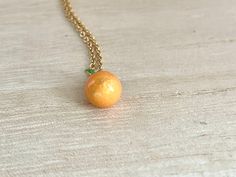 This dainty orange / tangerine necklace is made of the following: (1) Gold plated orange slice charm (charm size: 12 x 8.5mm) (2) Gold plated or 14KGF chain and findings ✏️ Please choose the length of the chain (the length includes clasp and findings) ✏️ Please choose your desired plating of chain ❣️ If you are unsure about which length to choose , please leave me a note to request an extension chain to be added to the chain at check out. 🍊EARRINGS 🍊 Threader -> https://www.etsy.com/listing Delicate Peach Jewelry For Gifts, Peach Necklace Gift, Peach Round Necklace For Gift, Peach Round Necklace Gift, Round Peach Necklace For Gift, Gift Round Peach Necklace, Orange Pendant Charm Necklaces For Gifts, Adjustable Round Orange Necklace, Orange Round Pendant Jewelry As Gift