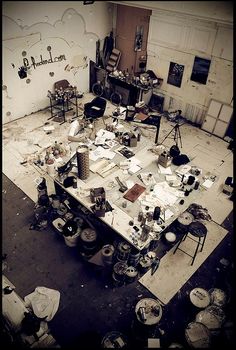 an old room filled with lots of clutter and junk on top of a table