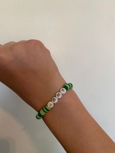 This is a small green army clay bead bracelet. Green Name Bracelet With Letter Beads, Green Letter Beads Name Bracelet For Friendship, Green Name Bracelet With Letter Beads For Friendship, Casual Green Personalized Name Bracelet, Casual Personalized Green Name Bracelet, Green Friendship Bracelets With Spacer Beads As A Gift, Green Personalized Bracelets With Round Beads, Personalized Green Bracelets With Round Beads, Green Friendship Bracelets With 8mm Beads As Gift