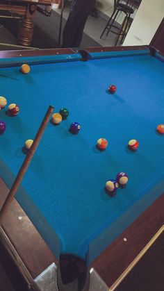 a pool table with several balls on it