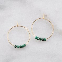 Delicate hoops — choose gold or silver, economical plated or luxe gold filled — with chunky malachite beads. Equally earthy and ethereal, perfect for every day. 25mm (about 1") gold-plated hoops with 2x3mm Malachite beads 25mm (about 1") gold-filled hoops with 2x3mm Malachite beads 25mm (about 1") silver-plated hoops with 2x3mm Malachite beads packaged on a hand-stamped kraft earring card in a clear resealing bag Not sure which gemstone to choose? This blog post might help: Get Your Woo-Woo on w Round Gemstone Beads Hoop Earrings As Gift, Gift Gemstone Beads Hoop Earrings, Everyday Round Gemstone Beads Jewelry, Gemstone Beads Hoop Earrings Gift, Spiritual Hoop Earrings With Ear Wire, Minimalist Everyday Hoop Earrings With Natural Stones, Everyday Minimalist Hoop Earrings With Natural Stones, Nickel-free 14k Gold Filled Hoop Jewelry, Small Hoop Earrings With Natural Stones For Everyday