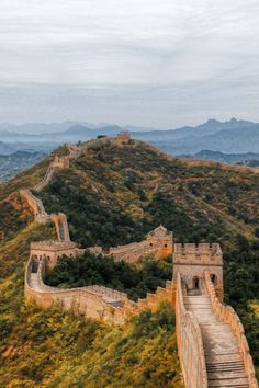 the great wall of china with stairs leading up to it