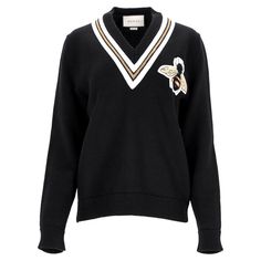 The Gucci Jumper With Bee Appliqu In Black Wool Showcases Timeless Elegance With A Touch Of Whimsy. Made From Luxurious Wool, This Sweater Features A White And Gold-Tipped V-Neckline Reminiscent Of Classic Cricket Styles, While The Iconic Bee Motif Appliqu Adds A Unique, Off-Kilter Crest-Like Charm. Pair It With A Collared Shirt To Channel A Sophisticated, Preppy Aesthetic. Gucci Jumper With Bee Appliqu In Black Wool Condition: Excellent Signs Of Wear: No Retail Tag But Brand Tag On., No Visible Gucci Jumper, Aesthetic Gucci, Gucci Jackets, Gucci Jacket, Gold Tips, New Packaging, Preppy Aesthetic, Collared Shirt, Brand Tags