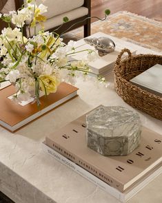 a table with flowers and books on it