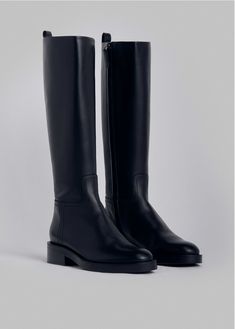 Our new riding boot made in classic smooth calfskin. Easy to slip on, side invisible zipper with leather tab. Round toe. Leather sole with anti-slip rubber padding. Details 100% Leather 0029MAR-BLA Made in Italy Heel Height = 2" (49mm) True to size Flat Tall Boots, Shoe Aesthetics, Classy Boots, Round Toe Boots, Riding Boots Fashion, Black Leather Riding Boots, Boots Ideas, Black Riding Boots, Tall Riding Boots