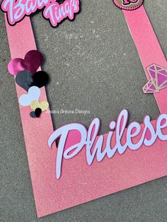 the name princess cut out from pink paper with black, white and gold decorations on it