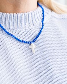 The perfect layering necklace with mother of pearl cross detail. Spiritual Blue Cross Pendant Necklace, Blue Cross Spiritual Necklace, Blue Adjustable Cross Necklace, Adjustable Blue Cross Necklace, Pearl Cross Necklace, Summer Necklace, Layering Necklace, Perfect Summer, Layered Necklaces