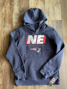 NWT NFL TEAM APPAREL New England Patriots Youth kids 14/16 Size Large Hoodie Sweatshirt. 100% Authentic. Ships from Ohio. Super soft!! Fan Merchandise Hooded Top With Drawstring Hood, Casual Sweatshirt With Adjustable Hood For Fans, Fan Merchandise Drawstring Hood Top, Fan Apparel Cotton Sweatshirt With Kangaroo Pocket, Cotton Fan Apparel Sweatshirt With Kangaroo Pocket, Throwback Cotton Hoodie Tops, Cotton Hoodie With Drawstring Hood For Fan Merchandise, Cotton Sweatshirt With Drawstring Hood For Fans, Casual Tops With Drawstring Hood For Fans