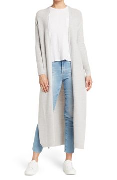 A knit duster jacket effortlessly layers over your look with it's longline fit. 49" length (size S) Open front Long sleeves Knit construction 75% acrylic, 22% nylon, 3% spandex Hand wash, dry flat Imported Model stats: 5'10" height, 32" bust, 25" waist, 36" hip. Model is wearing size S Versatile Knit Outerwear With Relaxed Fit, Cozy Long Spring Outerwear, Winter Knit Outerwear For Daywear, Open Front Sweater Coat For Winter Daywear, Long Knit Sweater Coat For Fall, Everyday Cozy Long Outerwear, Cozy Long Outerwear For Layering, Stretch Outerwear For Everyday Fall Use, Everyday Stretch Outerwear For Fall