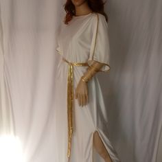 Greek Goddess Tunic Gown Is Made Of Soft Spandex Fabric. Slits On Both Sides Of Down. Gold Leaf Crown And Gold Belt Included Shoulder Drape Not Included. If You'd Like A Different Color Other Than White Message Me. Ancient Greek Dresses Women, Greek Dress With Sleeves, Sun Goddess Costume Dresses, Goddess Clothing Aesthetic, Toga Outfits For Women, Greek Toga Woman, Greek Goddess Inspired Outfit, Greek Princess Aesthetic, Greek Goddess Clothing