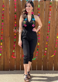 This Beautiful Halter Jumpsuit boasts a Traditional Mexican floral design combined with a modern style. The embroidered bodice with lace details combined with the halter top makes it fun and flirty. It's made out of fine Mexican cotton, has ties around the neck and elastic around the waist for an adjustable fit. This jumpsuit is handmade and hand embroidered by Mexican Artisans in Oaxaca, Mexico. It comes in one size: Small/Medium Purchase the shoes modeled here: https://www.etsy.com/es/listing/ Summer Party Jumpsuits And Rompers With Floral Embroidery, Floral Embroidered Jumpsuits And Rompers For Summer Parties, Embroidered Fitted Sleeveless Jumpsuits And Rompers, Embroidered Jumpsuits And Rompers For Summer Parties, Spring Embroidered Fitted Jumpsuits And Rompers, Embroidered Fitted Jumpsuits And Rompers For Spring, Halter Top Romper, Embroidered Bodice, Womens Jumpsuits