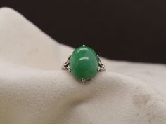 Year: 1950s Item Details: Ring Size: 6.75 Metal Type: Platinum [Hallmarked, and Tested] Weight: 5 grams Jade: 3ct, oval cabochon shape, green Band Width: 2.1mm Condition: Excellent Price: $1500 This ring can be sized up or down 4 sizes for an additional $40. If you wish to have a ring sized please purchase the item and note the size in the message section. Payment & Refund Details: More Pictures Available on Request Payment via Visa/Mastercard/Discover/AmericanExpress, check, money order or PayPal. Layaway * We will be more than happy to provide layaway payments for your convenience to make it easier to have the opportunity to enjoy one of our collection's treasure! Please contact us in advance so we can work out a payment plan best suited to your wants and needs. If you are able to visit Check Money, Money Order, Detailed Ring, Payment Plan, Jade Ring, Oval Cabochon, Visa Mastercard, Rings Statement, Types Of Metal