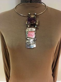 A  vintage one of a kind brutalist style very rare and unique piece of handcrafted contemporary jewelry by artist John Heller from Halifax, Mass circa 1980 Handmade of silver, amethyst geode, pearl and pink agate  John Heller was a professor of art at Bridgewater University from 1968- 2001 when he passed away. He was a sculptor, jeweler, metallurgist and potter. Many of his works remain at the University on display for all to enjoy. This is a rare statement piece and the only necklace / collar / Modern Natural Stone Pendant Jewelry, Silver Choker With Natural Stones, Silver Choker Jewelry With Natural Stones, Brutalist Pendant Jewelry Gift, One Of A Kind Artisan Purple Jewelry, Silver Artisan Choker Jewelry, Modern Purple Metal Jewelry, Artisan Silver Choker Jewelry, Artisan One-of-a-kind Purple Jewelry