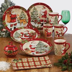 a christmas themed dinnerware set on a table