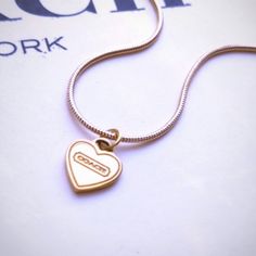 Coach Heart Charm W Gold Plated Necklace New Authentic Coach Heart Charm On A Brand New Gold Plated Snake Chain Necklace. . Necklace Is Gold Plated .18" Length. . Coach Stamped On Both Sides Of The Charm. .Free Gift Box And Gift Wrapping Coach Heart Charm Jewelry, Coach Heart Charm Heart Jewelry, Coach Gold Heart-shaped Jewelry, Coach Heart-shaped Gold Jewelry, Coach Heart-shaped Jewelry For Gift, Coach Elegant Heart-shaped Jewelry, Coach Elegant Heart Jewelry, Elegant Coach Heart-shaped Jewelry, Elegant Coach Heart Shaped Jewelry