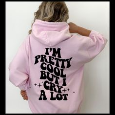 Our I'm Pretty Cool But I Cry Alot Wavy Trendy Women's Hoodie Sweatshirt is the perfect statement piece to add to your wardrobe! With a vibrant and bold design, this hoodie will make a statement wherever you go.  The wavy bubble lettering across the back of the hoodie captures the attention of anyone who sees it, while still making a statement of style and comfort. Made from a soft and comfortable cotton/poly fabric, this hoodie is perfect for lounging around in, running errands, or even wearing Trendy Hooded Tops With Graphic Print, Trendy Hooded Top With Graphic Print, Trendy Hooded Top With Letter Print, Trendy Graphic Print Sweatshirt For Winter, Pink Hip Hop Sweatshirt With Graphic Print, Oversized Pink Graphic Print Hoodie, Oversized Pink Hoodie With Graphic Print, Trendy Winter Graphic Tops, Pink Hoodie Sweatshirt With Graphic Print