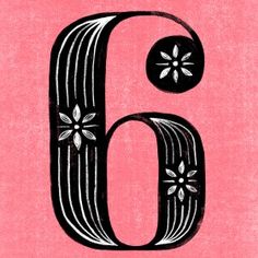 the letter b is made up of black and white flowers on a pink paper background