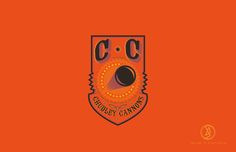 an orange and black logo with the word ccc on it's side,