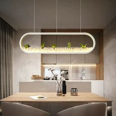 a dining room table with two chairs and a light fixture hanging over it's head