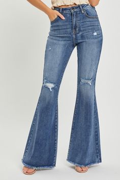 Make a bold fashion statement with these high waist distressed flare jeans that exude a trendy and edgy vibe. The high waist design provides a flattering fit while the distressed detailing adds a touch of urban chic to your ensemble. With a flare leg silhouette, these jeans offer a vintage-inspired look that is both stylish and versatile. Perfect for creating retro-inspired outfits, these jeans can be dressed up with heels or down with sneakers for a variety of occasions. Elevate your denim game Raw Hem Flare Jeans, Retro Inspired Outfits, Distressed Flare Jeans, Baywatch, Urban Chic, Flare Jeans, Outfit Sets, Jumpsuit Dress, Jumpsuit Romper