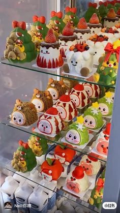 a display case filled with lots of different types of cakes