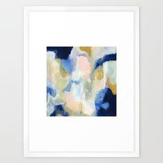 an abstract painting with blue, yellow and white colors in a white frame on the wall