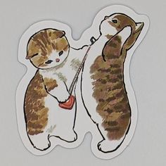 a sticker depicting two cats playing with each other on a white surface and one cat is holding the string in its paws