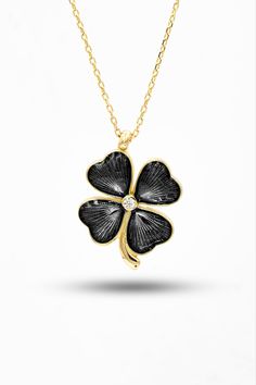 Clover necklace 14K Gold This Leaf 14k Gold Necklace is a beautiful accessory that will bring out the delicate beauty in you. This lovely necklace is crafted with care and precision, designed with a clover-shaped pendant and handcrafted with a delicate 14k gold chain. It has a graceful look that will make heads turn, and bring out your inner radiance. The chain of this exquisite necklace is strong and durable - it won't easily break or snag, so you can wear it for years to come. The small clover Black Tarnish-resistant Charm Necklace As Gift, Elegant 14k Gold Necklaces For Good Luck, Elegant 14k Gold Necklace For Good Luck, 14k Gold Necklace With Black Enamel For Gift, Gold Plated Black Jewelry For Gift, Black Gold Plated Jewelry Gift, Black Gold Plated Jewelry As Gift, Black Gold Plated Jewelry For Gift, Black Gold-plated Jewelry For Gifts