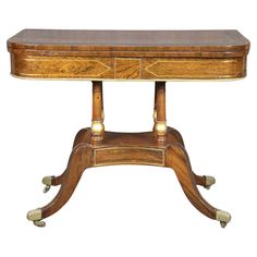 an antique wooden table with two legs