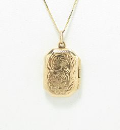 14k gold .5 x .75" condition: excellent Dainty and sweet antique locket, crafted of 14 karat yellow gold.  The locket is from the 1940s, and measures .5" wide and just under .75" high, not including the bail.  It has a rectangular shape, and is embellished with repousse period details on the front cover of the locket.  This locket is so lovely! The locket is in excellent condition inside and out.  It is marked 14k and is guaranteed to be 14k gold.  Please note that this listing is for the locket Vintage 14k Gold Locket Necklace, Vintage 14k Gold Locket Necklace Stamped 14k, Elegant Hallmarked Locket Necklace For Formal Occasions, Heirloom Yellow Gold Locket Necklace For Anniversary, Victorian Yellow Gold Locket Necklace For Formal Occasions, Heirloom Hallmarked Locket Necklace For Anniversary, Formal Heirloom Locket Necklace Stamped 14k, Gold Locket Necklace With 17 Jewels For Wedding, Heirloom Locket Necklace For Anniversary