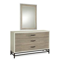 a dresser with a mirror on top of it