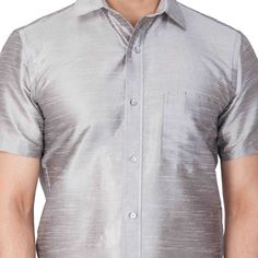 VM By VASTRAMAY Men's Grey Silk Blend Ethnic Shirt Elevate your ethnic wear collection with this classic VM By VASTRAMAY shirt. Crafted from a luxurious silk blend, this shirt offers a comfortable and stylish drape. Pair it with your favorite trousers or jeans for a perfect evening look. Key Features Grey solid ethnic shirt Shirt collar Full button placket One patch pocket Short regular sleeves Straight hem Specifications Sleeve Length: Short Top Shape: Straight Top Hemline: Straight Top Length: Elegant Semi-formal Festive Shirt, Traditional Festive Shirt For Formal Occasions, Festive Fitted Shirt For Semi-formal Occasions, Festive Fitted Semi-formal Shirt, Elegant Short Sleeve Kurta For Festive Occasions, Semi-formal Silk Shirt, Dhoti Pants For Men, Stylish Drapes, Sleeveless Blouse Saree